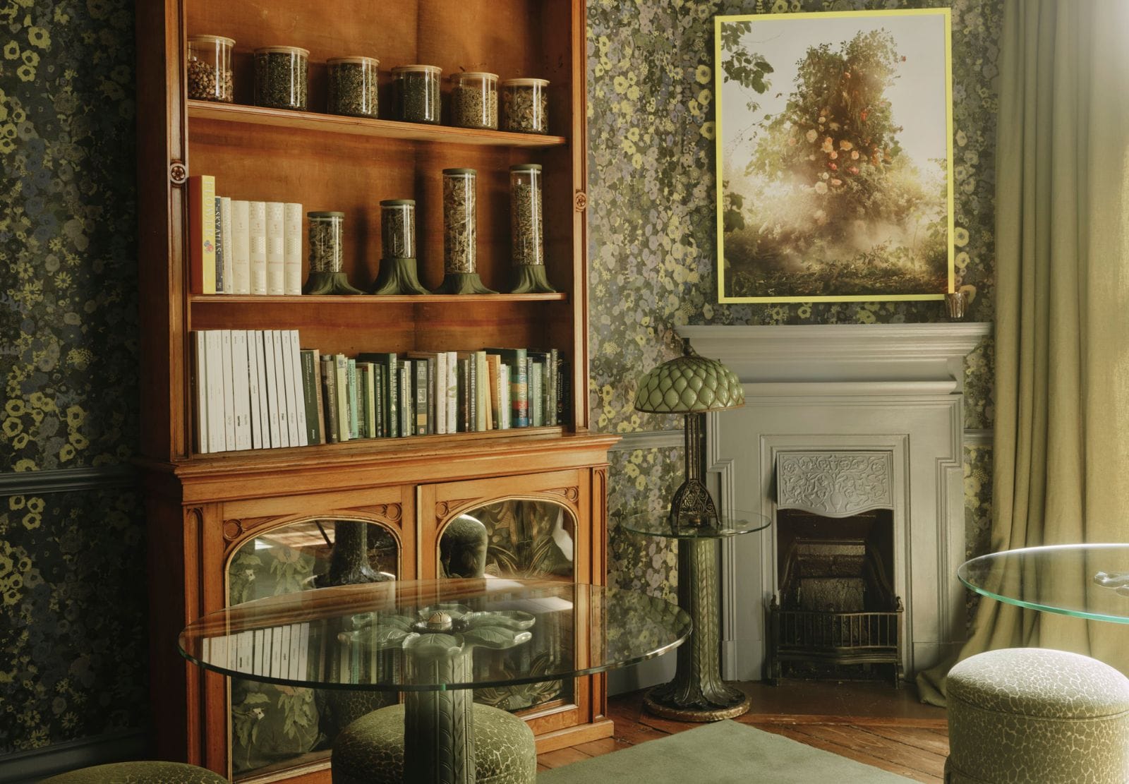 Floral wallpaper around a fireplace and a timber bookcase in a finished room at the House of Hackney showroom.