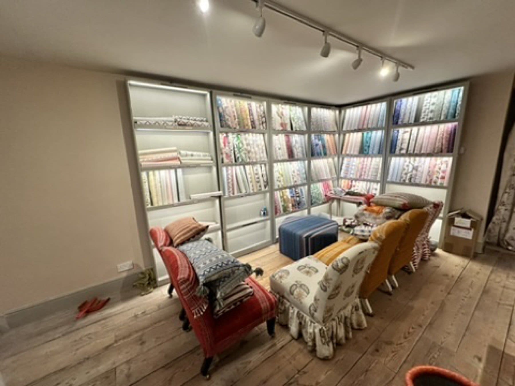 Close view of large-scale floral wallpaper in the Penny Morrison showroom.