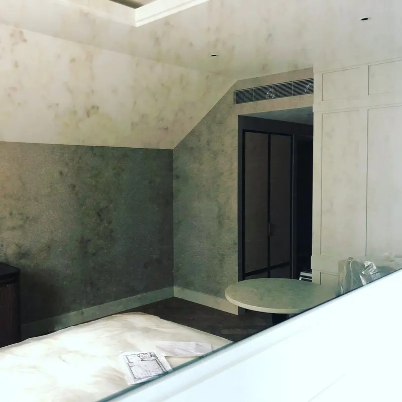 Hotel room under fit-out with wallcovering hung and floor protection down, the Millennium Hotel, Grosvenor Square, now The Biltmore Mayfair.
