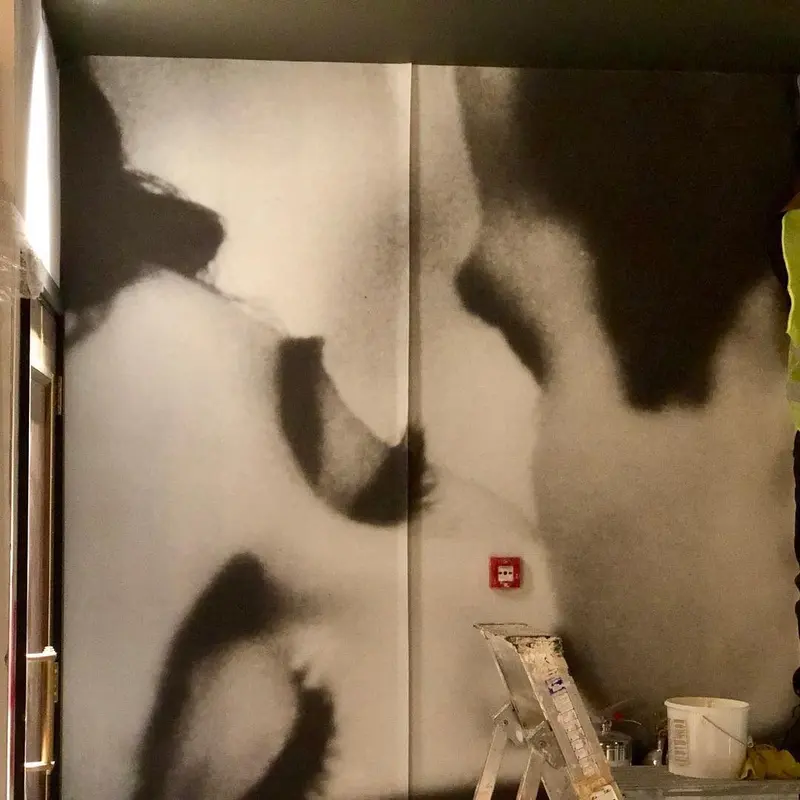 Large black-and-white film mural fitted floor to ceiling in a corridor of the Everyman cinema, Liverpool.