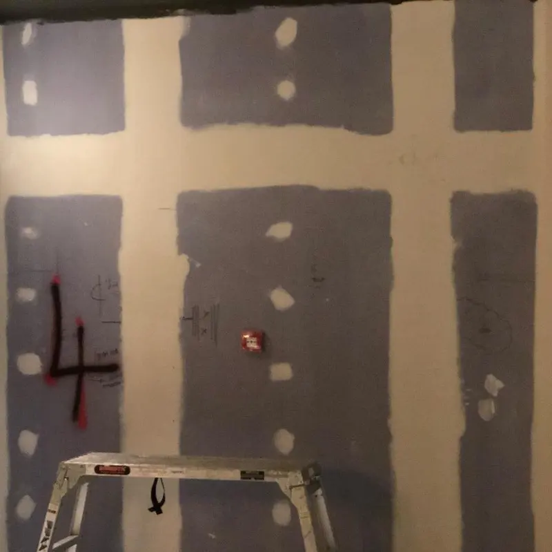 Wall prepared with lining panels before mural installation, the Everyman cinema, Liverpool.