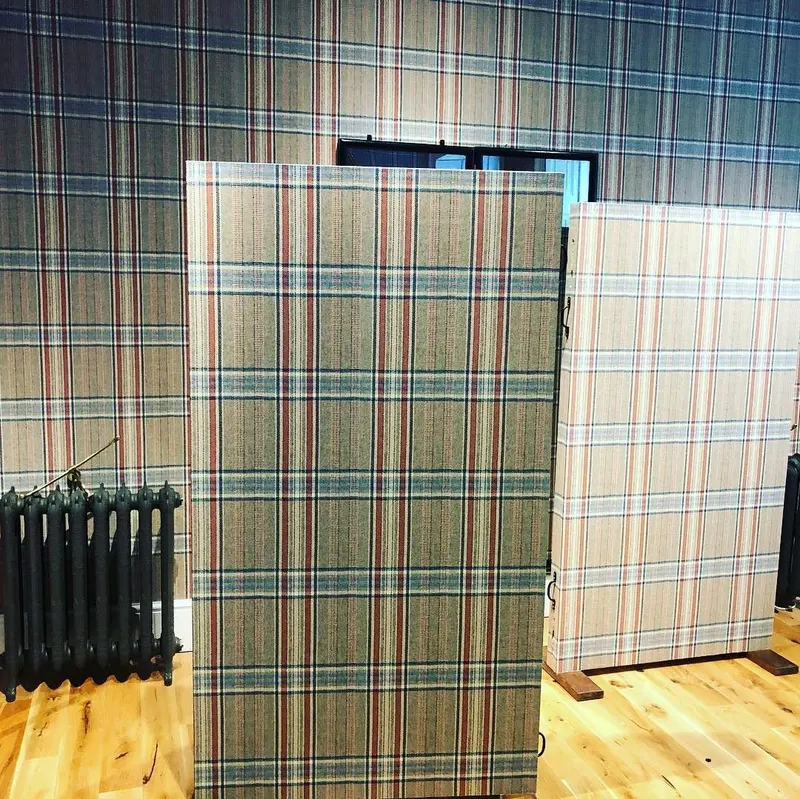 Bespoke display boards covered in Huntsman tweed print.