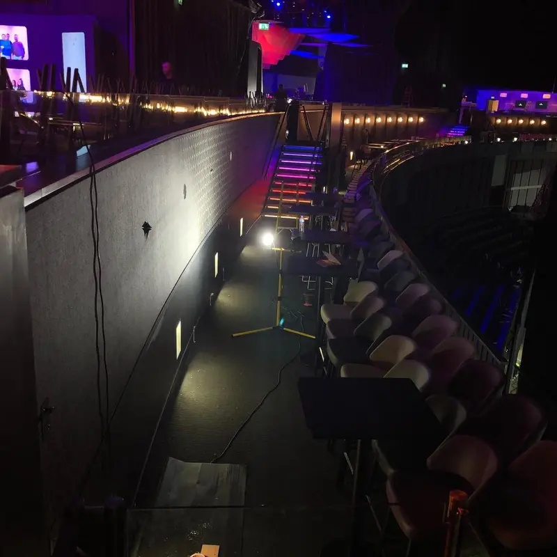 Seating zone with patterned wallcovering under coloured lights, Oxygen Freejumping, The O2.