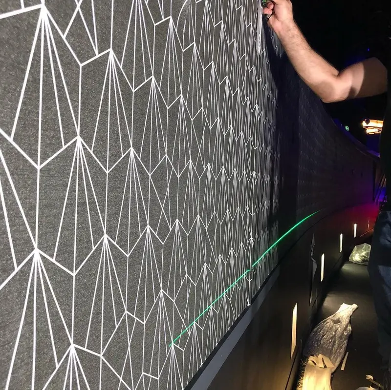 Fine-line geometric wallcovering hung with overlap-and-splice joints, Oxygen Freejumping, The O2.