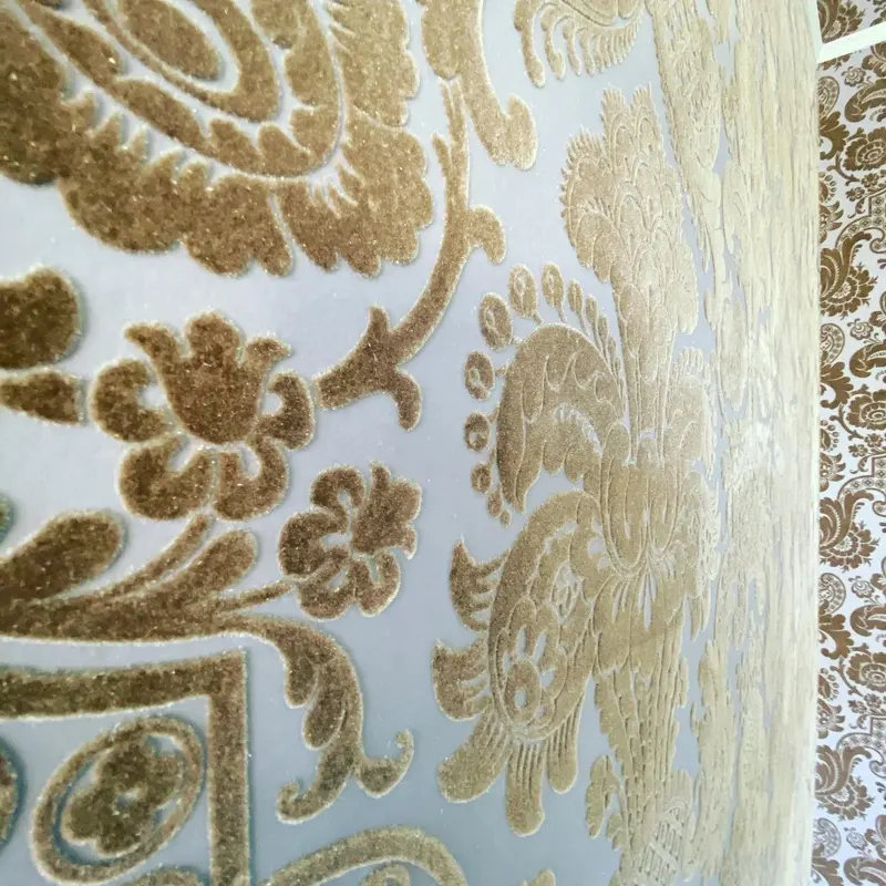 Close-up of Cole & Son Petroushka velvet flock in gold on cream, Pendley Manor Hotel, Tring.