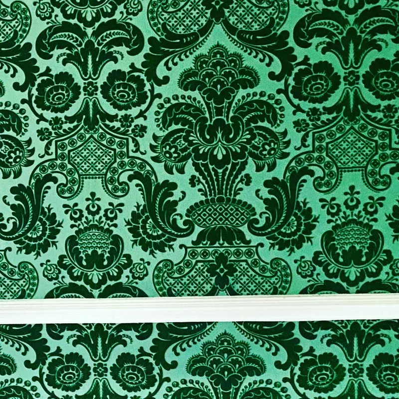 Close-up of green velvet flock damask wallpaper, Pendley Manor Hotel, Tring.