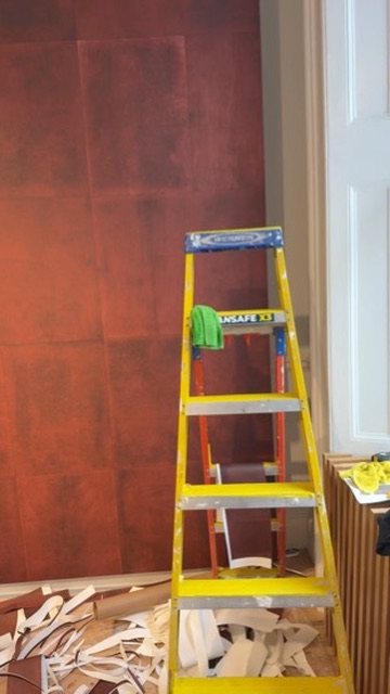 Calico Wallpaper Cadence in Oxblood going up on the feature wall.