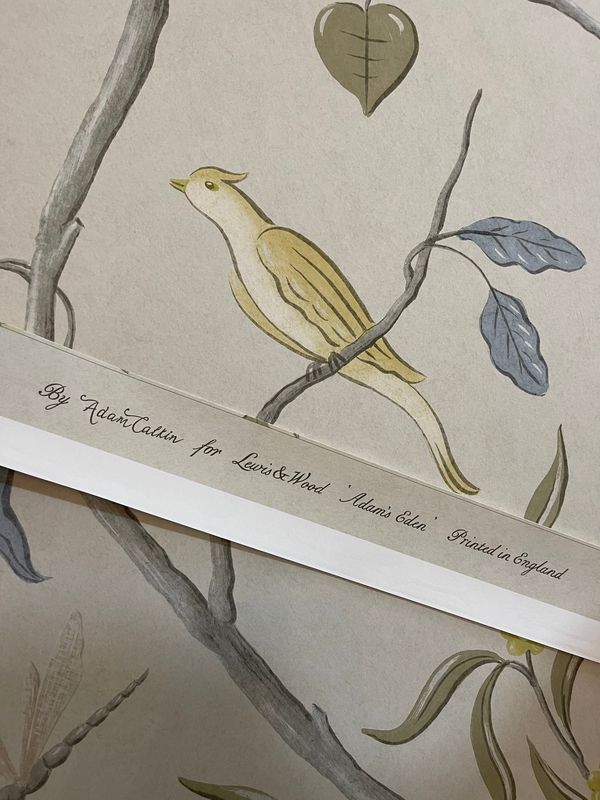 Close view of Adam's Eden wallcovering by Adam Calkin for Lewis & Wood at Brown's Hotel, Mayfair: a yellow bird on a branch above the printed selvedge.
