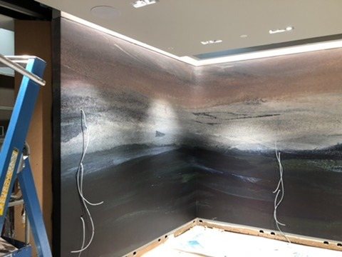 Calico Wallpaper landscape mural across two walls of the store, before the fixtures went in.