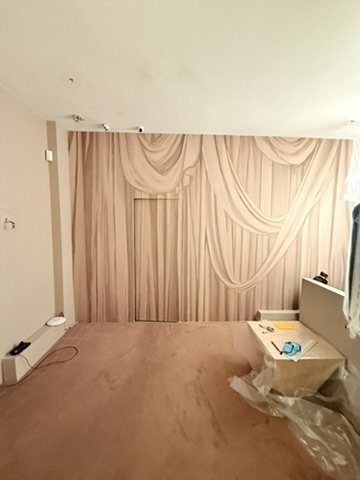Overture drapery wallpaper hung across the room at Lee Broom's Shoreditch showroom, before the room was dressed.