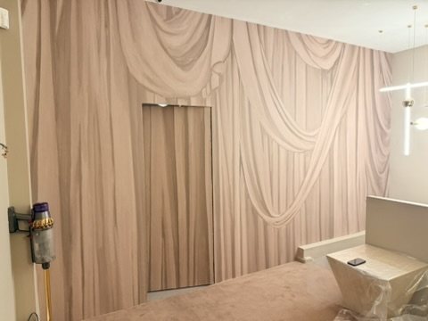 Overture panels on the side wall of the showroom.