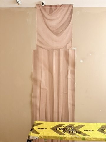 A full Overture drop hung, before trimming at the skirting.
