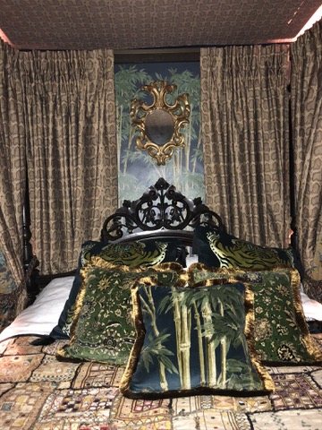 Four-poster bed against House of Hackney Bambusa wallpaper in the Midnight colourway.