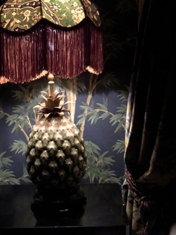 Pineapple lamp in front of Bambusa Midnight wallpaper.