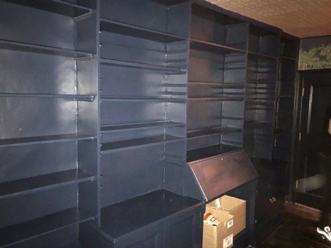 Built-in bookshelves painted dark blue.