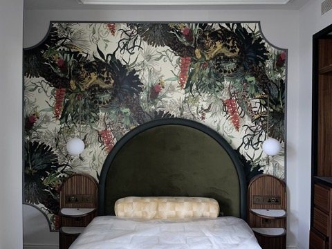 Sample room at Hyde London City with a Timorous Beasties Tropical Clouded Leopard panel behind the bed.
