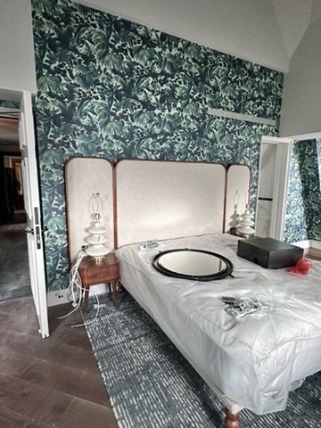 Suite bedroom at Hyde London City wrapped in House of Hackney Limerence palm wallpaper.