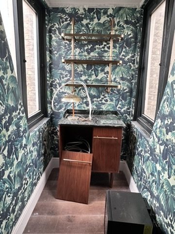 Dressing area of the suite in House of Hackney Limerence wallpaper.