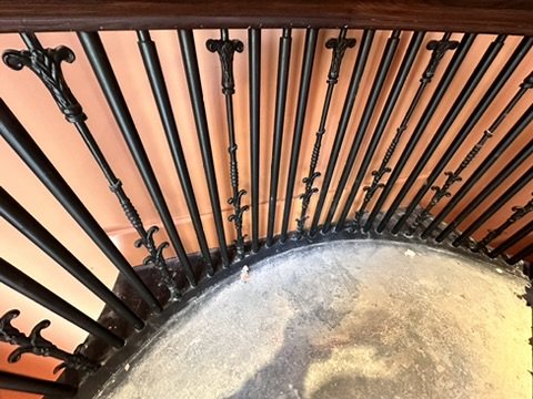 The stair balustrade and timber handrail seen from above.