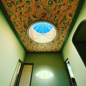 Papered atrium ceiling around an oval skylight at the Castle of Trematon.